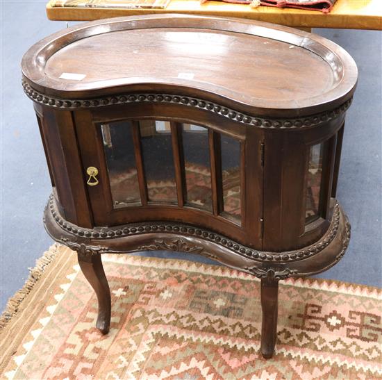 A reproduction kidney-shaped glazed tray-top cabinet W.76cm